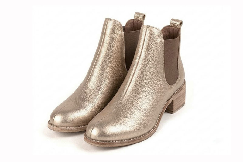 Women's gold and bronze solid-color chelsea boots with round toe and leather sole - Front view